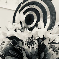 a black and white photo of a flower arrangement